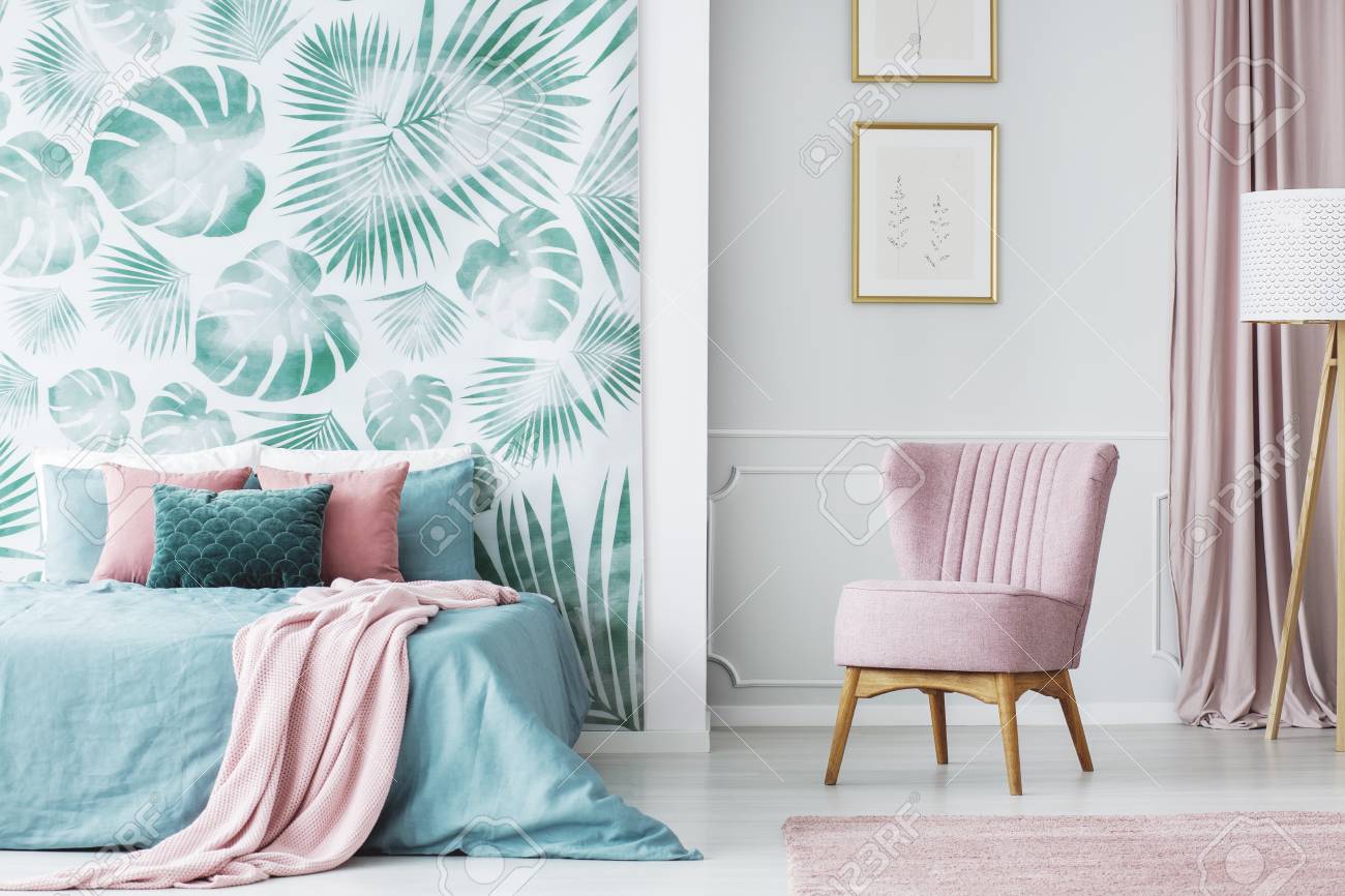 Comfortable Pale Pink Upholstered Chair In A Cozy Bedroom Interior