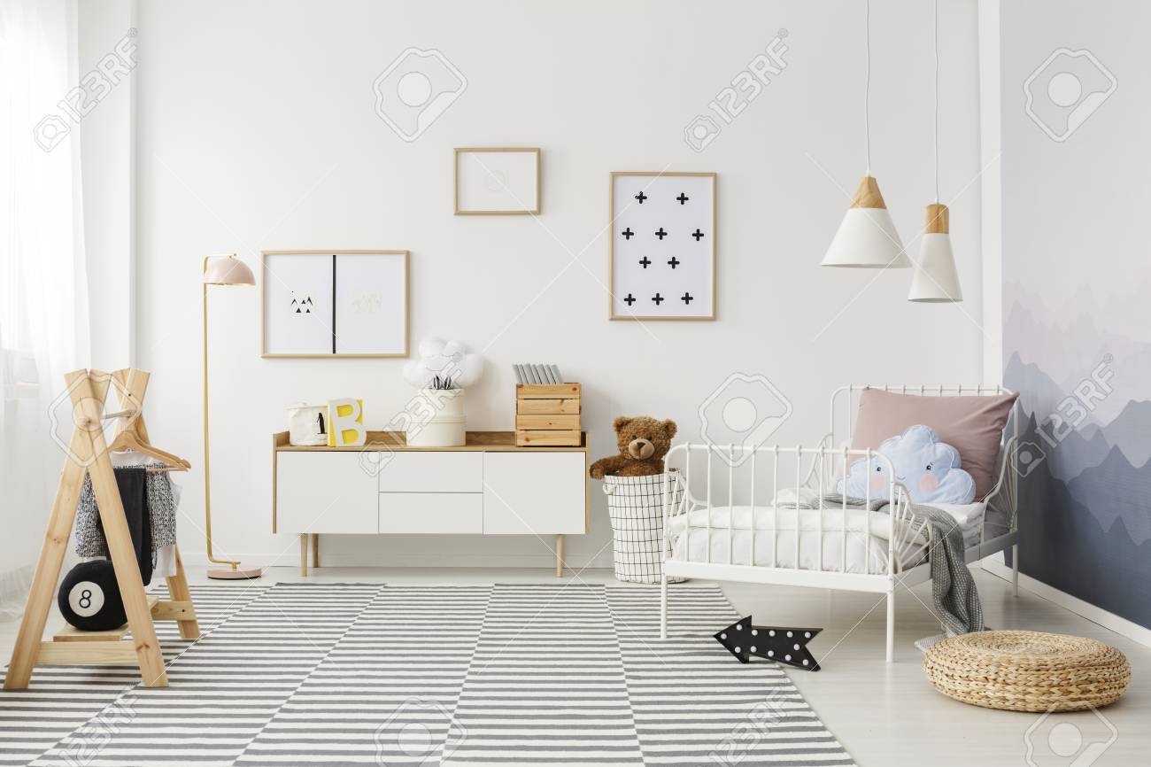 Simple Posters Hanging On The Wall In White Children Bedroom