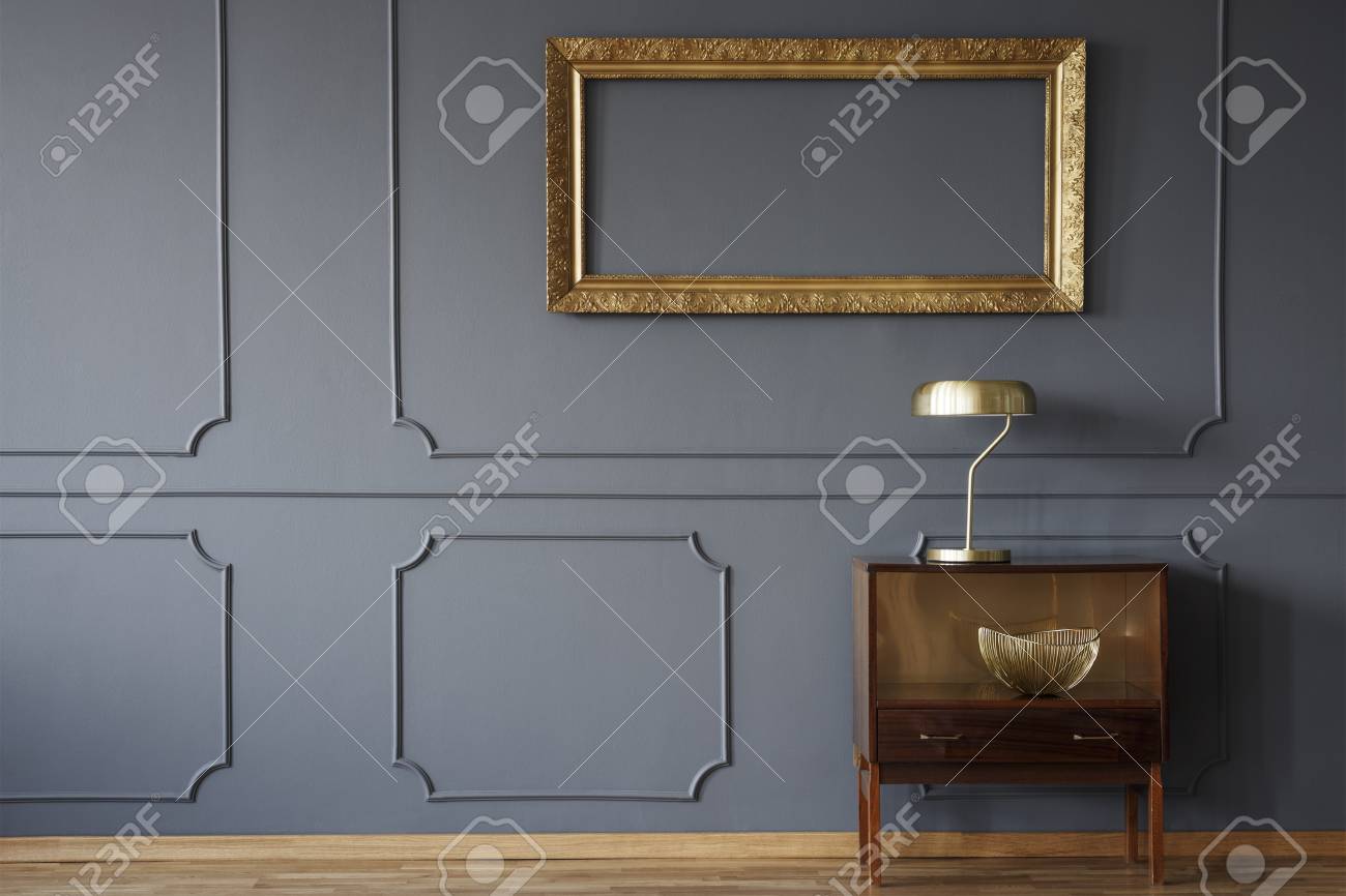 Vintage Wooden Cabinet And An Elegant Empty Golden Frame On Stock Photo Picture And Royalty Free Image Image 105229944