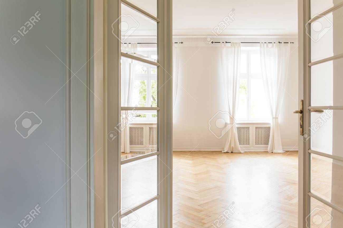 View Through Open Glass Door On An Empty Bright Bedroom Interior