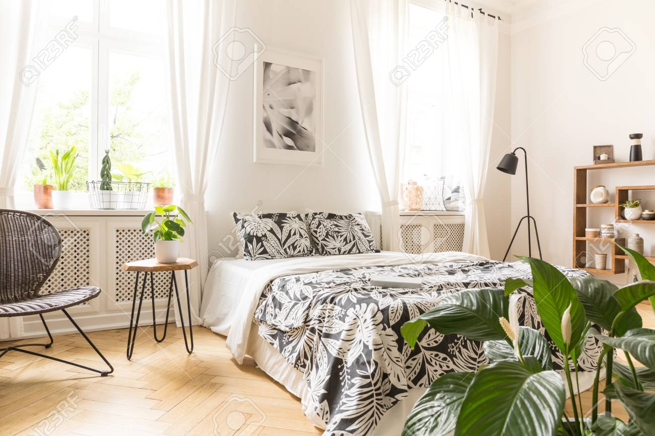 Leaf Motif Linen On A Big Bed In A Modern Bedroom Interior With