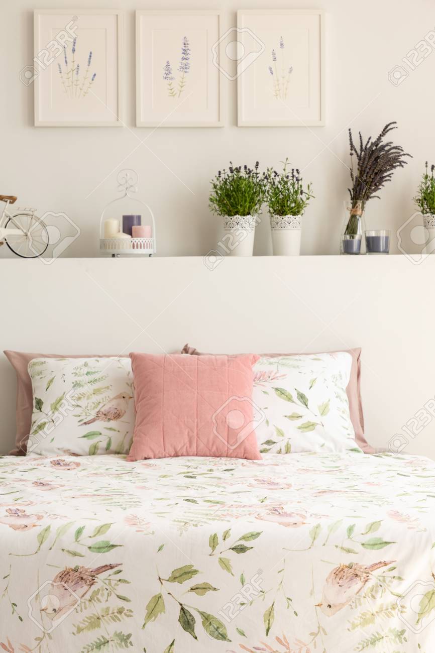 Floral Bedding And Pastel Pink Cushion On Double Bed In Real Stock Photo Picture And Royalty Free Image Image 107096204
