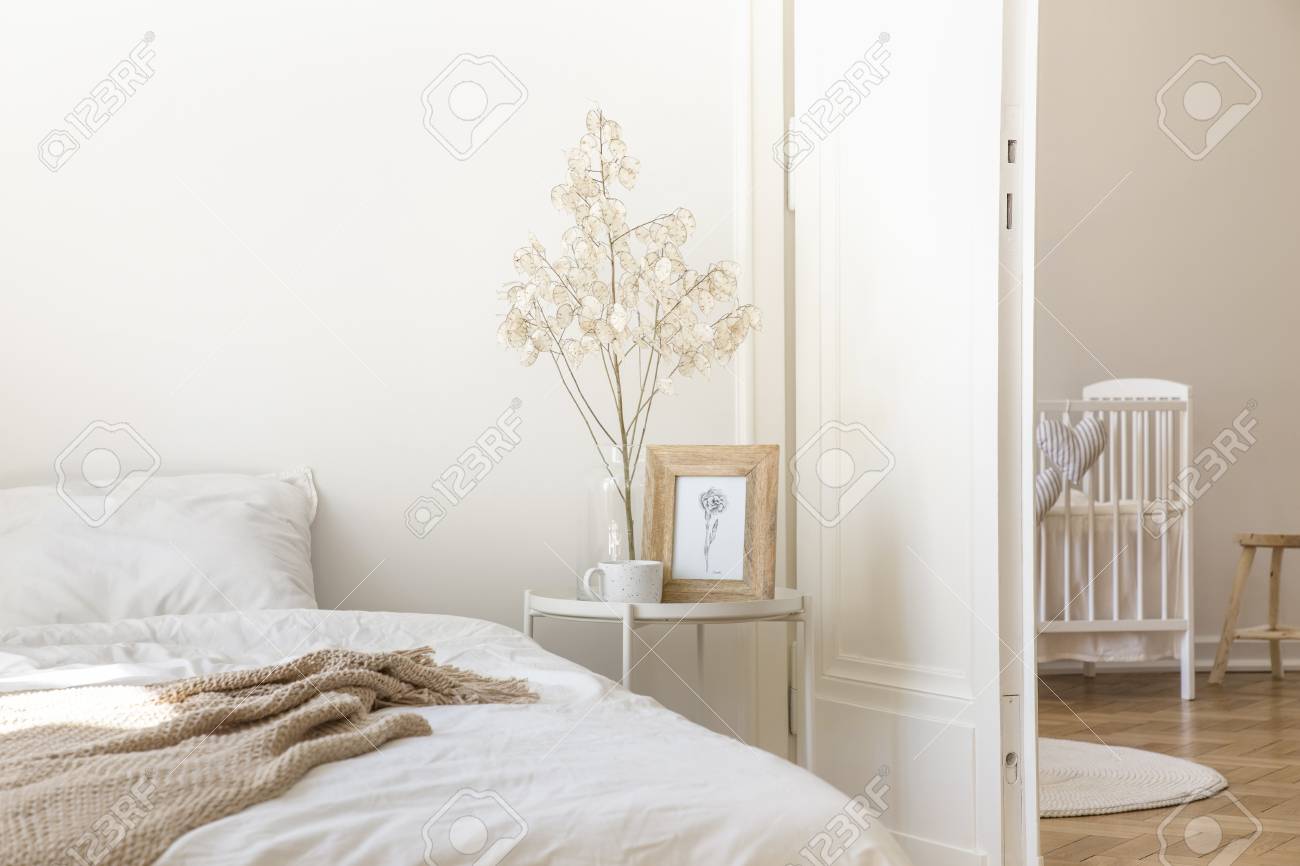 White Metal Bedside Table With Coffee Mug Twig In Glass Vase Stock Photo Picture And Royalty Free Image Image 108539870