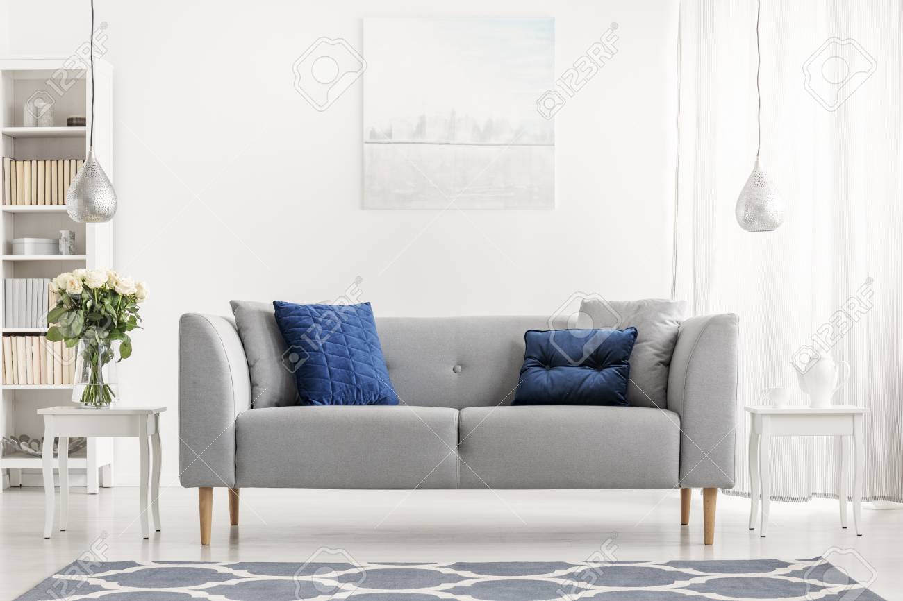 blue couch with pillows