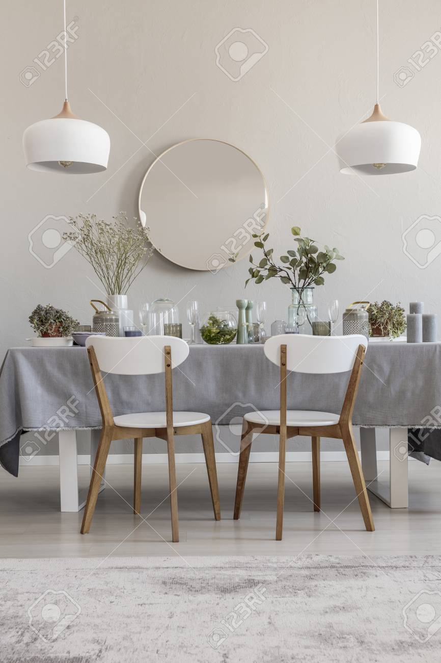 White Chairs At Table In Elegant Dining Room Interior With Round Stock Photo Picture And Royalty Free Image Image 110949038