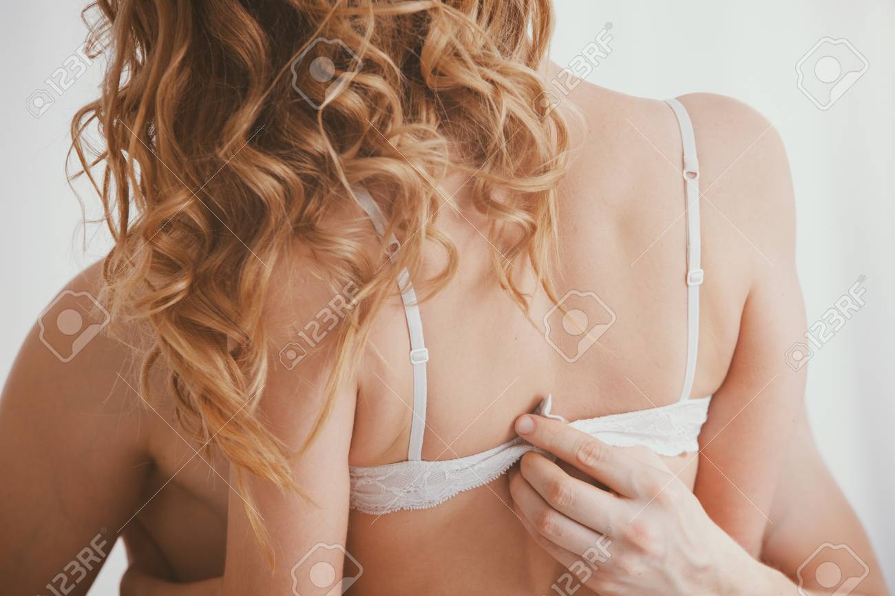Close-up On Man Unfastening Woman's Bra During Romantic Sex Stock Photo,  Picture and Royalty Free Image. Image 112561194.