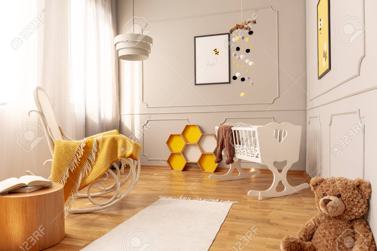 Yellow Blanket On White Wooden Rocking Chair In Spacious Baby