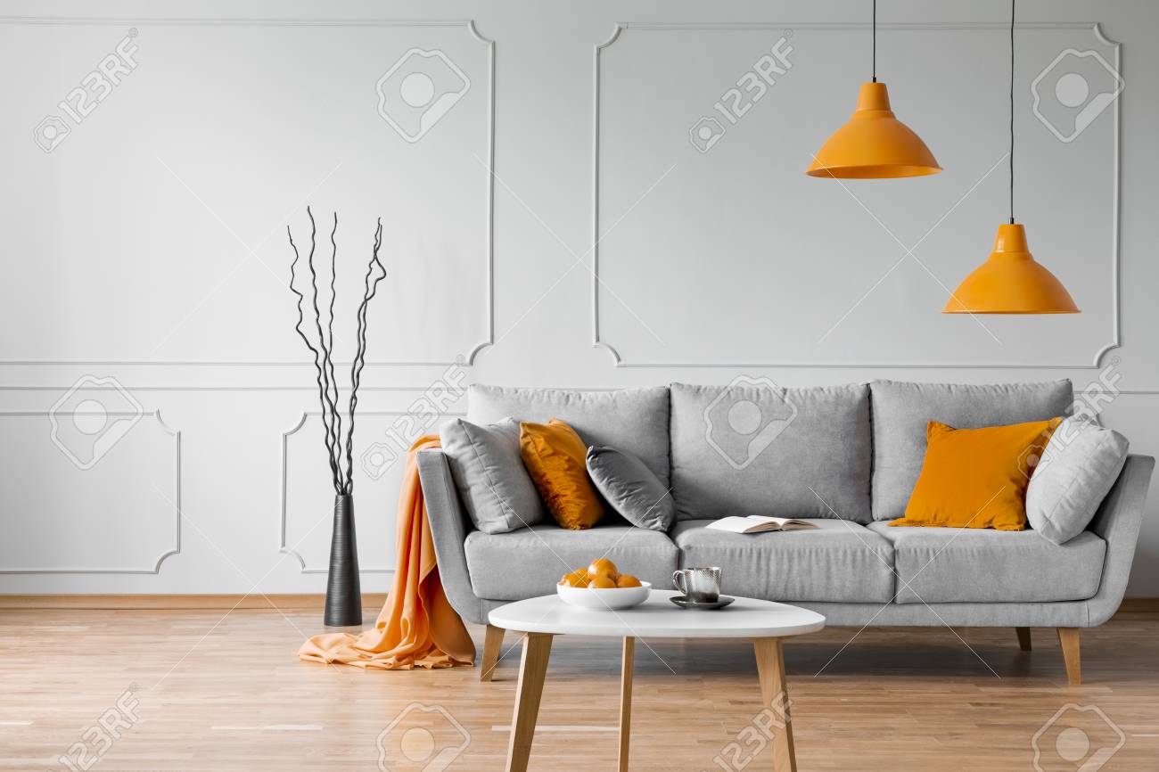 gray and orange pillows