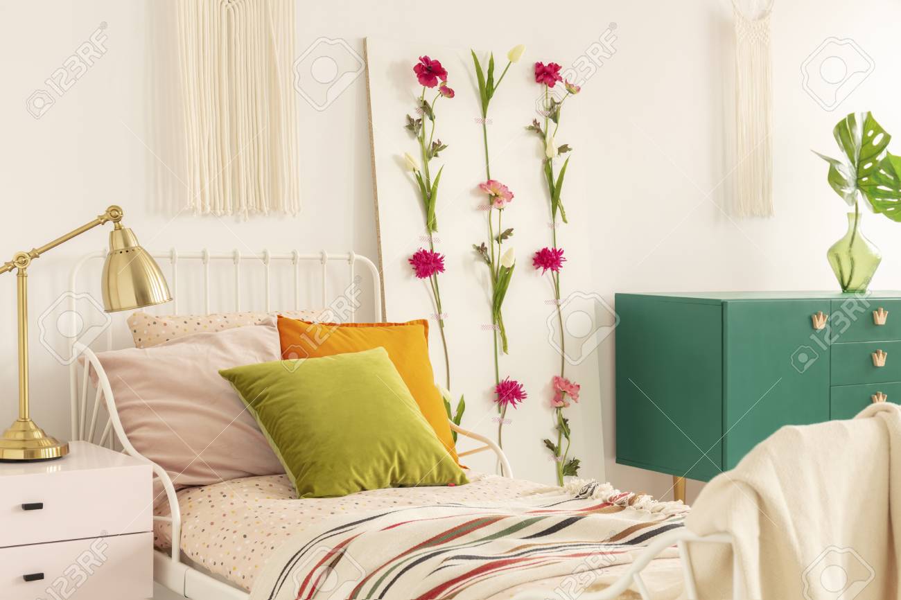 Golden Lamp On Pastel Pink Nightstand Next To Single Metal Bed Stock Photo Picture And Royalty Free Image Image 121457933