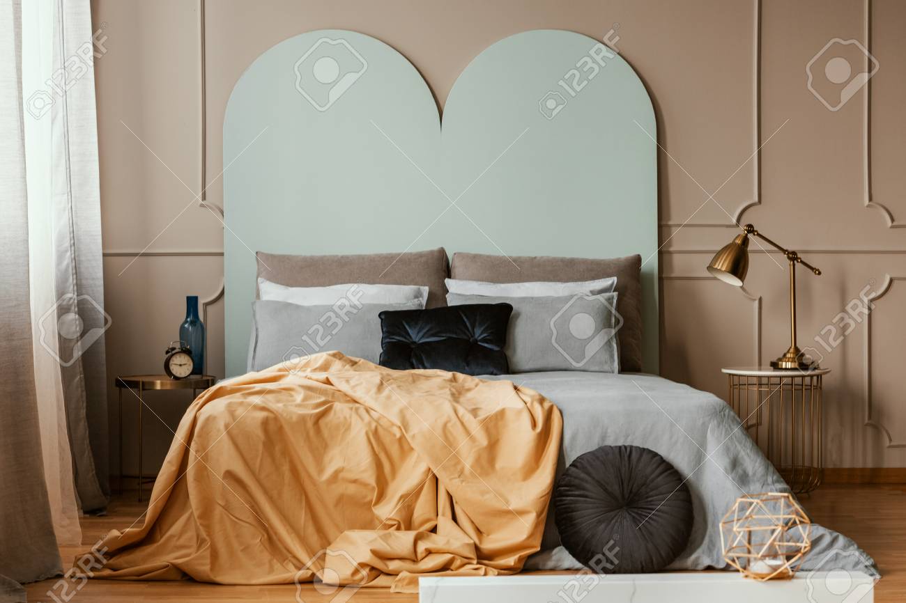 Pastel Blue Headboard Of King Size Bed With Cozy Bedding And