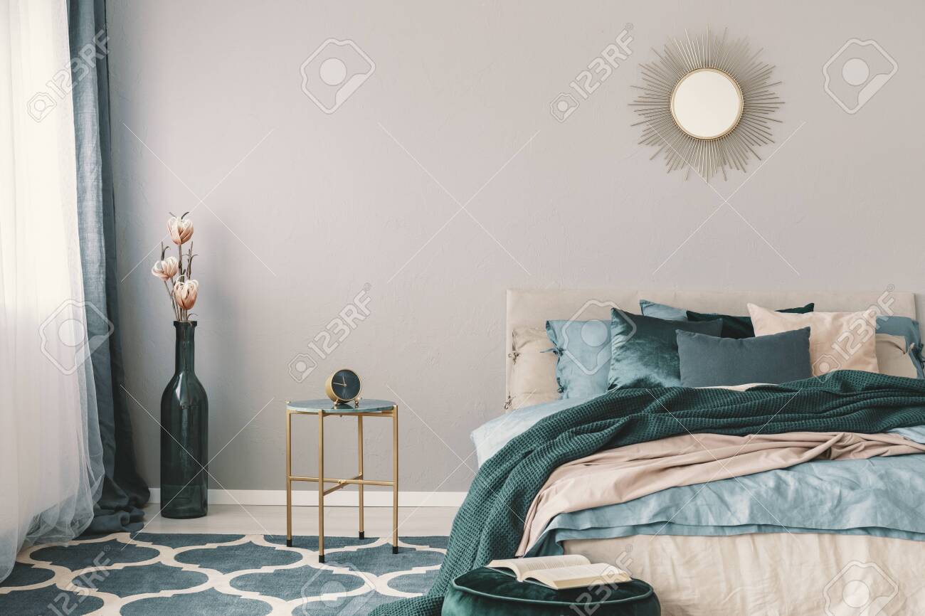 Flowers In Stylish Bottle Like Vase Next To Trendy Nightstand Stock Photo Picture And Royalty Free Image Image 124577481