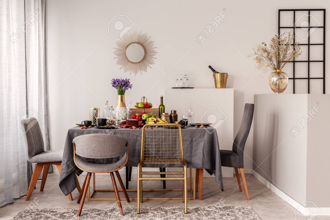 Trendy Mirror In Golden Frame On White Wall Of Elegant Dining Stock Photo Picture And Royalty Free Image Image 127522031
