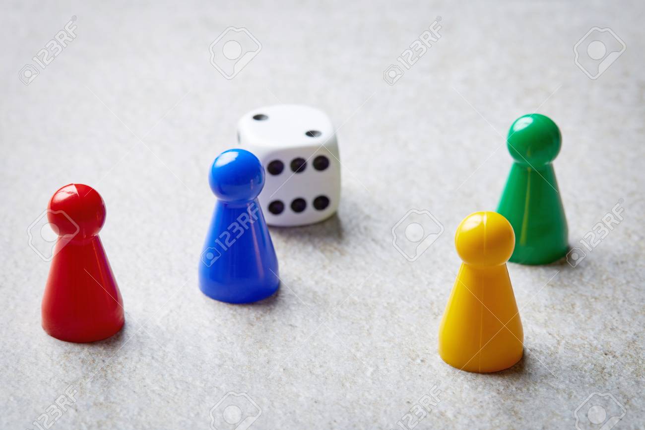 colorful board game counters and dice on stone table stock photo picture and royalty free image image 60459335