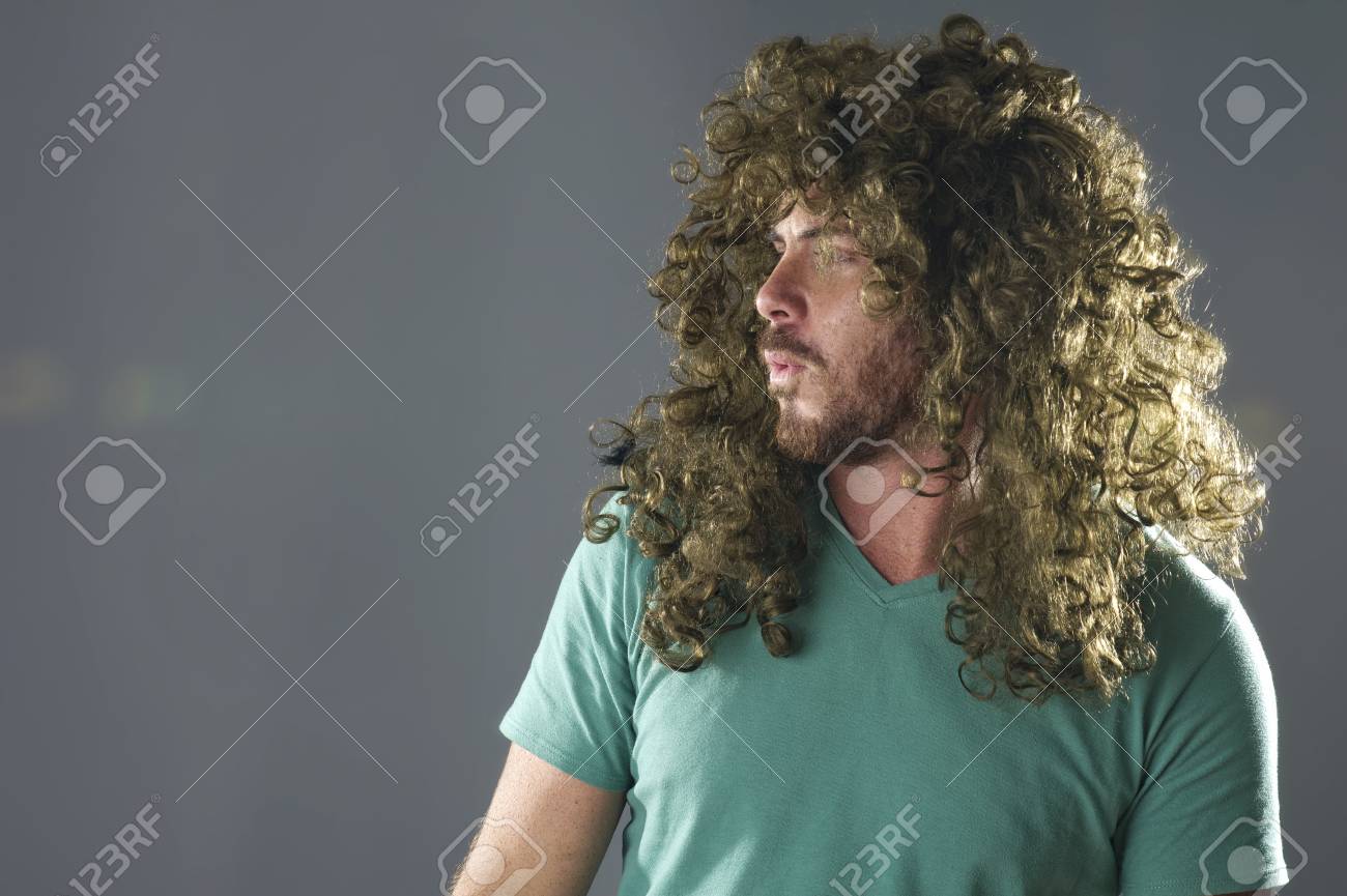 A Guy With A Funky Hairstyle Posing