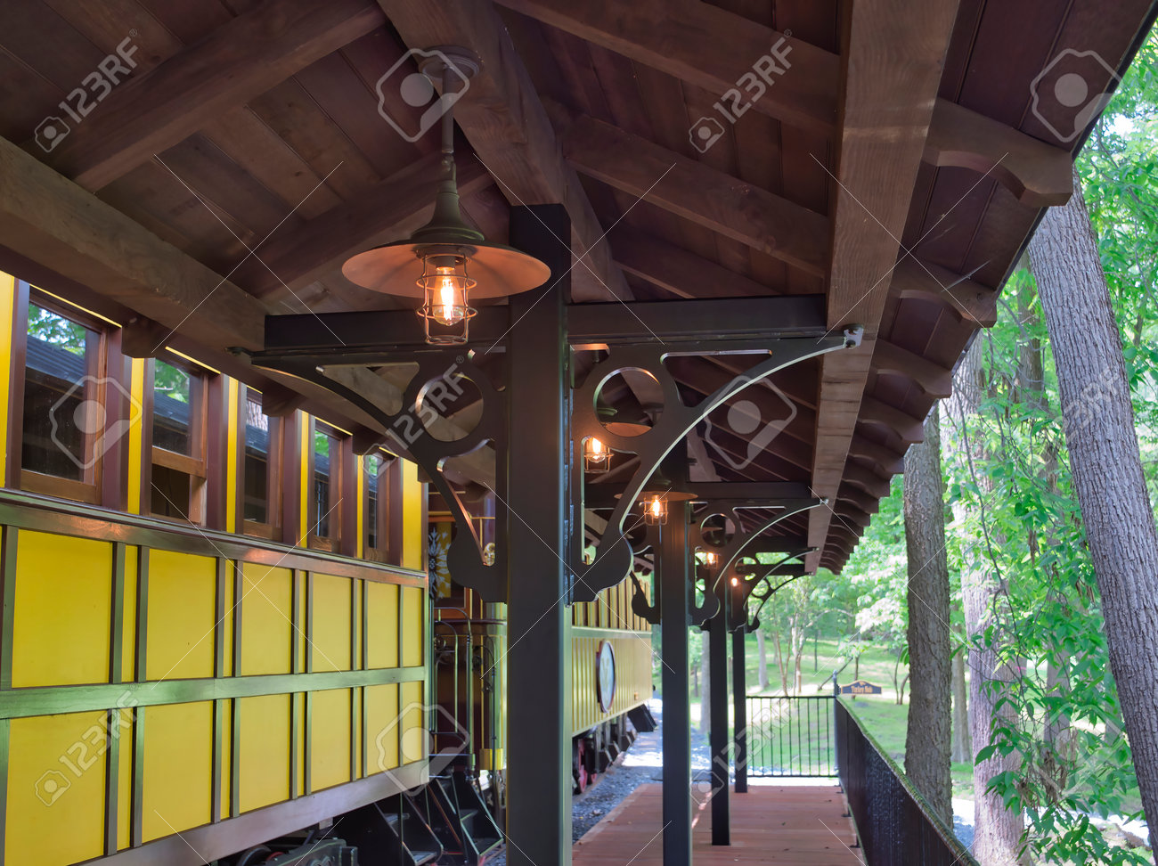 A Train Station Platform with an Antique Passenger Car - 162658704 A Train Station Platform with an Antique Passenger Car - 162658704