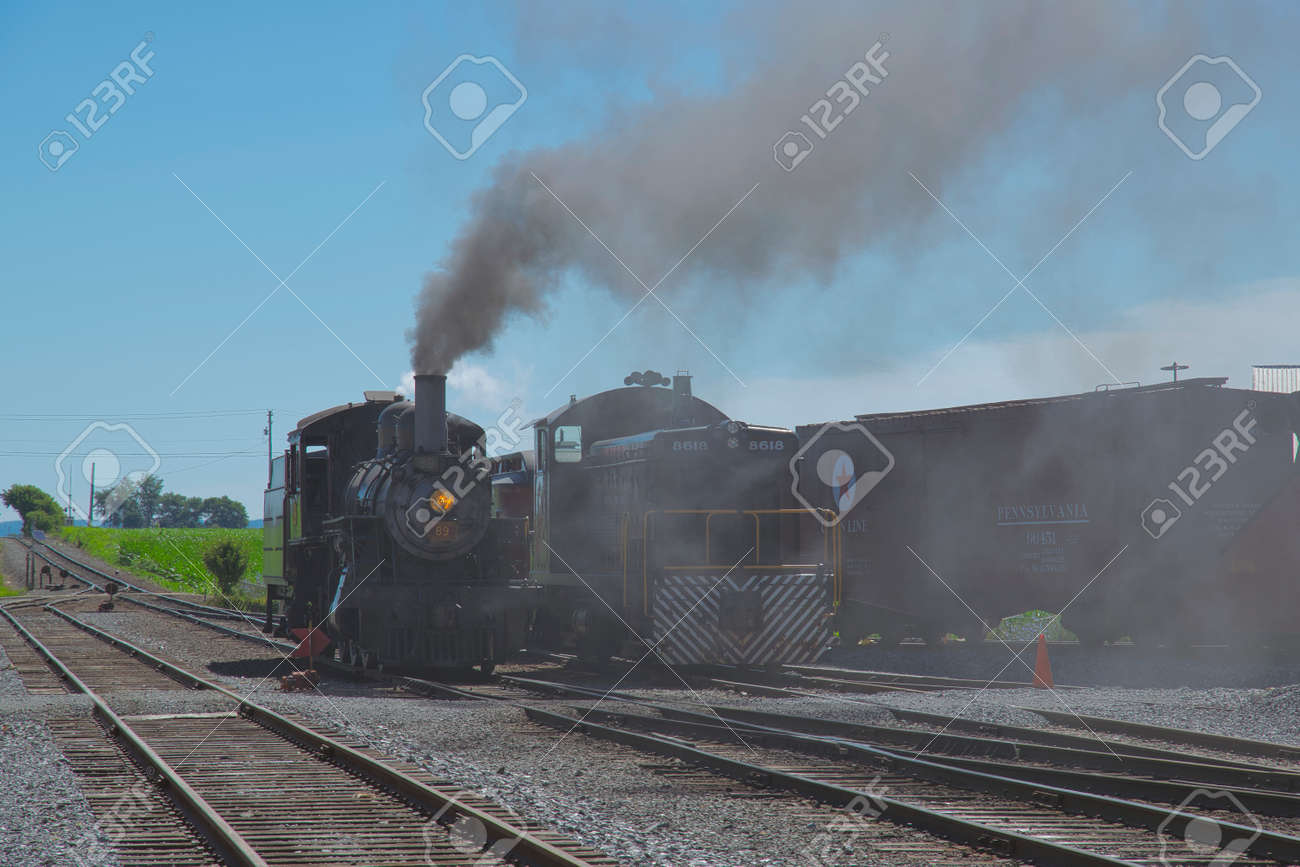Strasburg, Pennsylvania, July 2018 - A 1906 Steam Locomotive and a Diesel Locomotive Seating Side by Side - 165167368 Strasburg, Pennsylvania, July 2018 - A 1906 Steam Locomotive and a Diesel Locomotive Seating Side by Side - 165167368