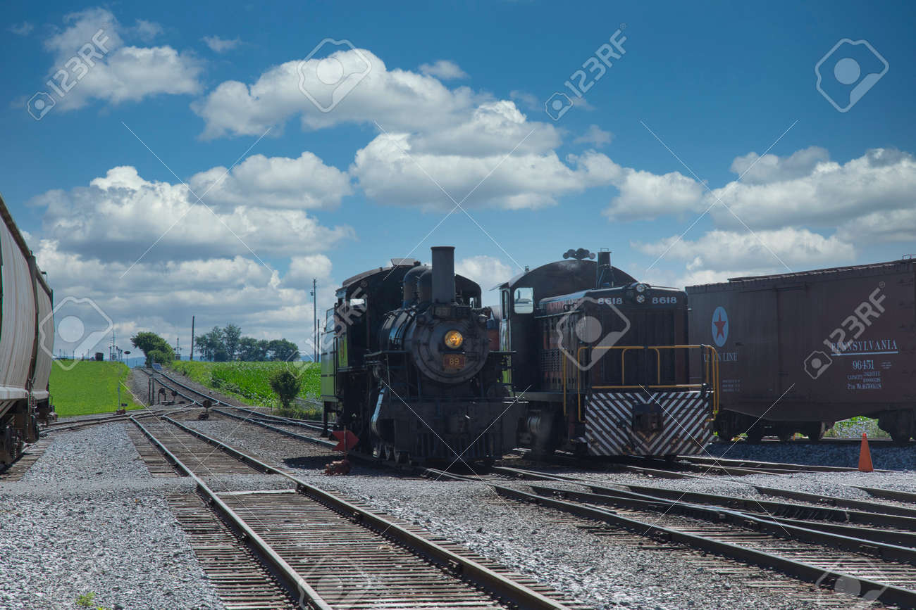Strasburg, Pennsylvania, July 2018 - A 1906 Steam Locomotive and a Diesel Locomotive Seating Side by Side - 165167367 Strasburg, Pennsylvania, July 2018 - A 1906 Steam Locomotive and a Diesel Locomotive Seating Side by Side - 165167367