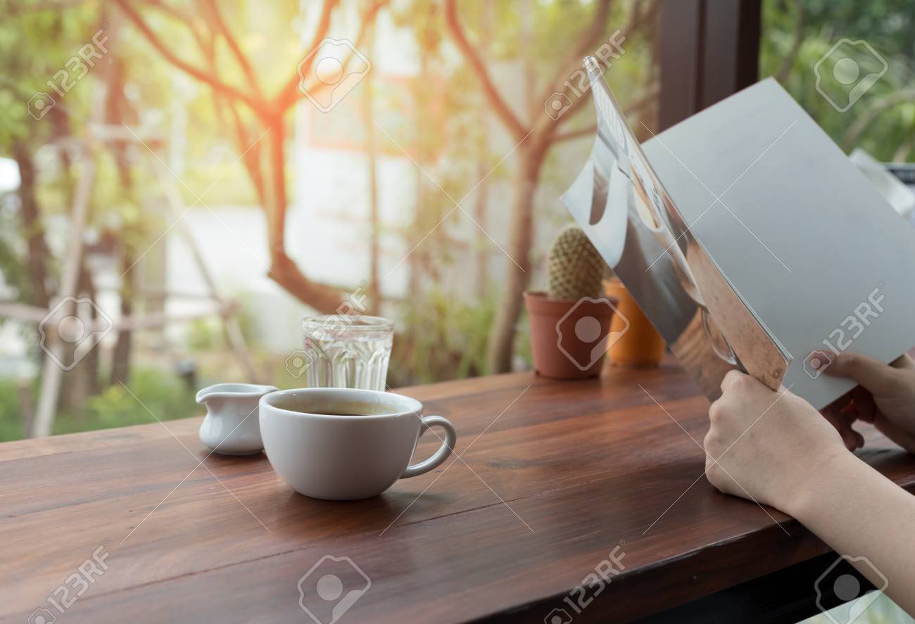 Asian people reading book and fresh cup of coffee on the table - 91199855 Asian people reading book and fresh cup of coffee on the table - 91199855