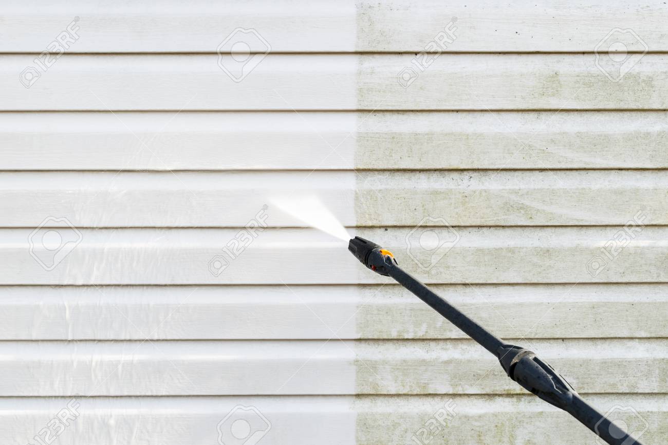 Cleaning service washing building facade with pressure water. Cleaning dirty wall with high pressure water jet. Power washing the wall. Cleaning the facade of the house. Before and after washing - 121954589 Cleaning service washing building facade with pressure water. Cleaning dirty wall with high pressure water jet. Power washing the wall. Cleaning the facade of the house. Before and after washing - 121954589
