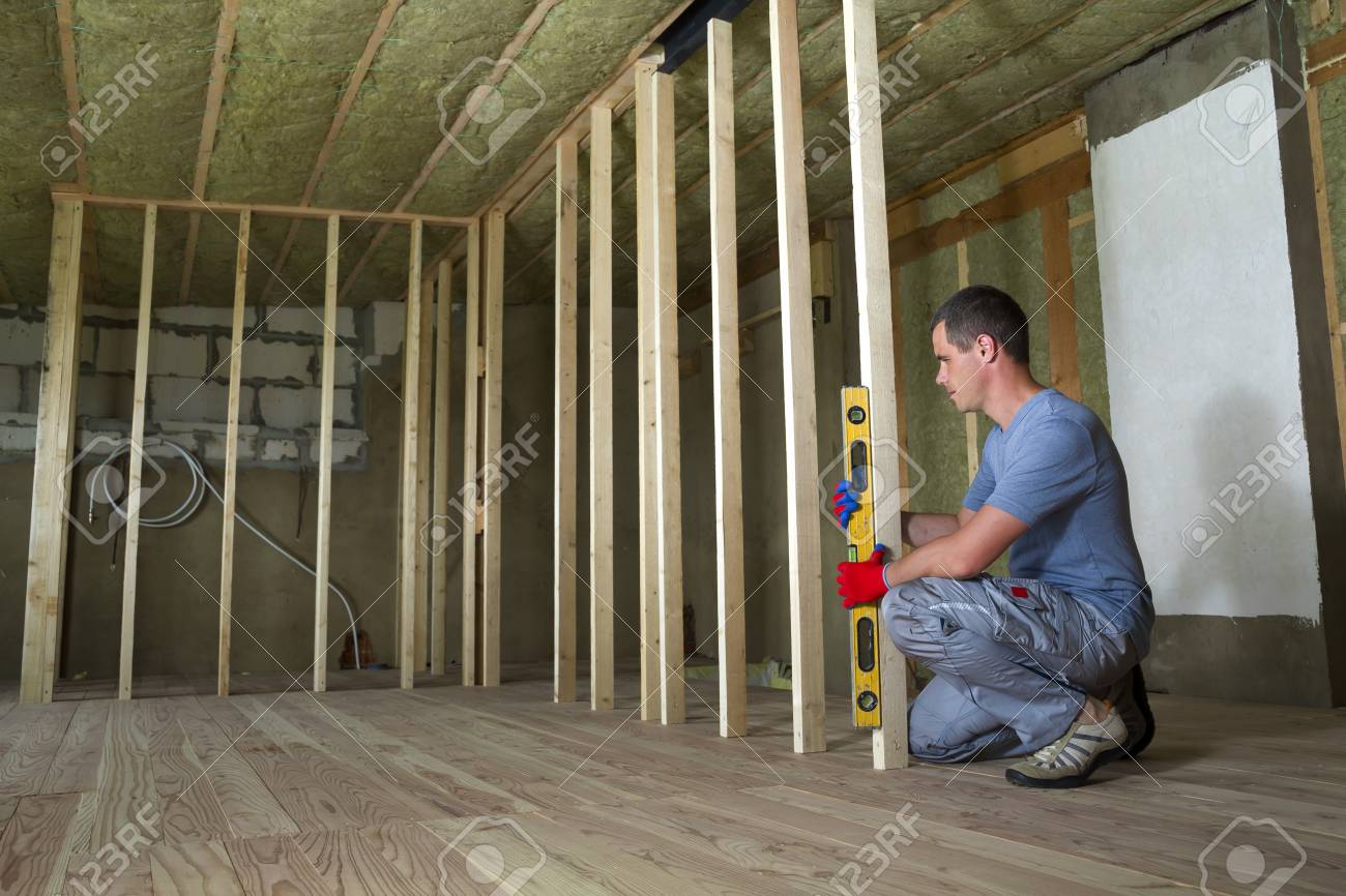 Interior Of Attic Room With Insulated Ceiling And Oak Floor Under
