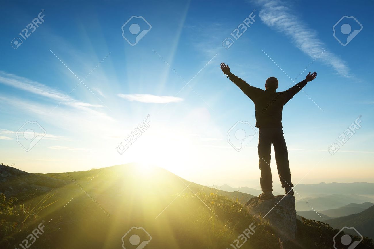 winner on mountain top sport and active life concept stock photo