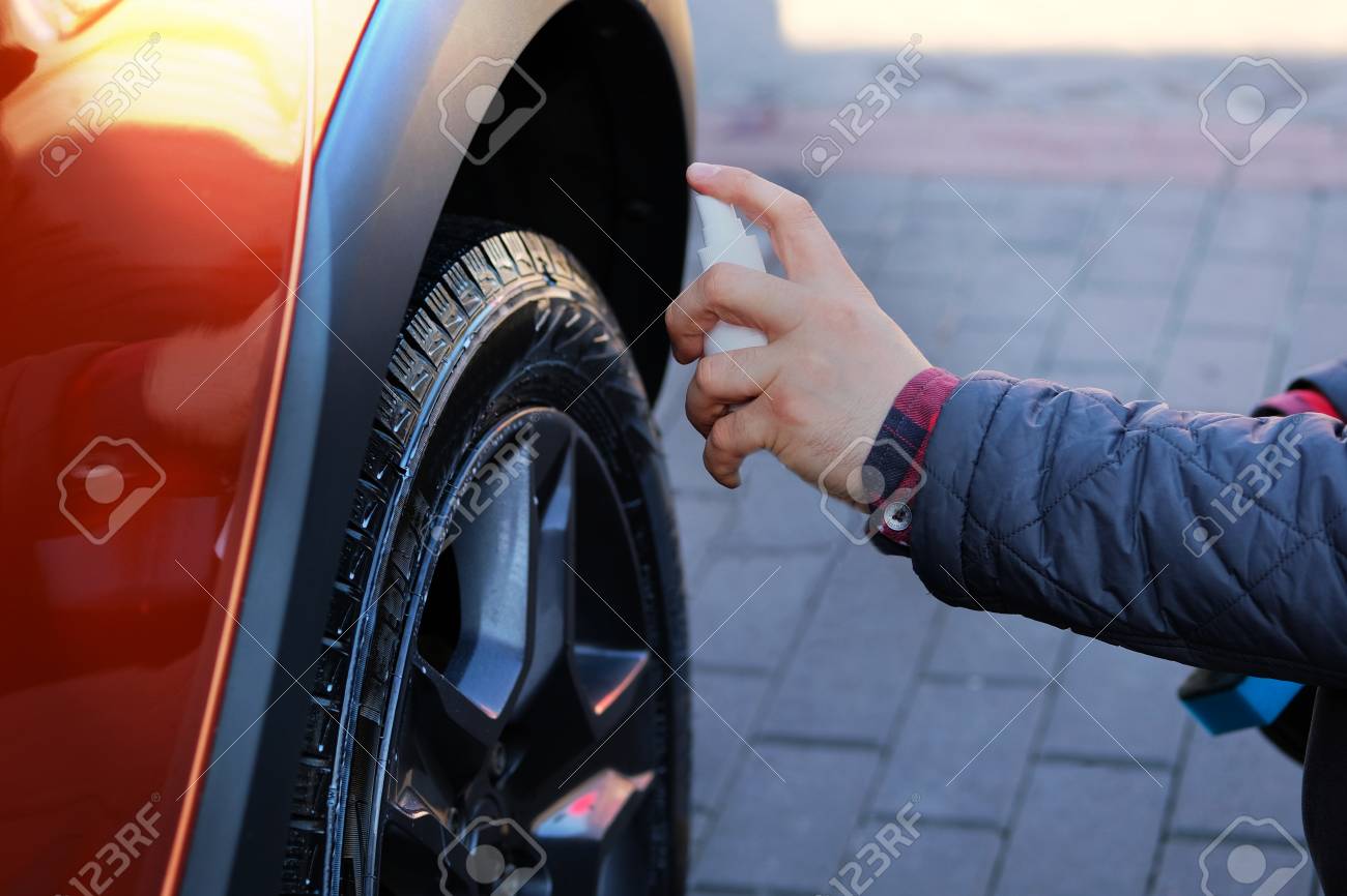 Spray Car Wash >> Man After Washing Applies Tire Cleaner With A White Spray Orange Spray Car Wash >> Man After Washing Applies Tire Cleaner With A White Spray Orange