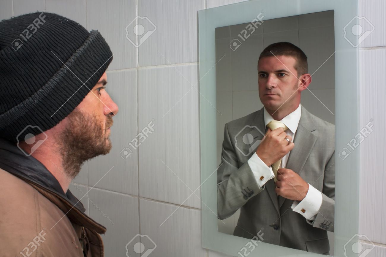 homelss man looking in mirror and seeing dreams of the future stock