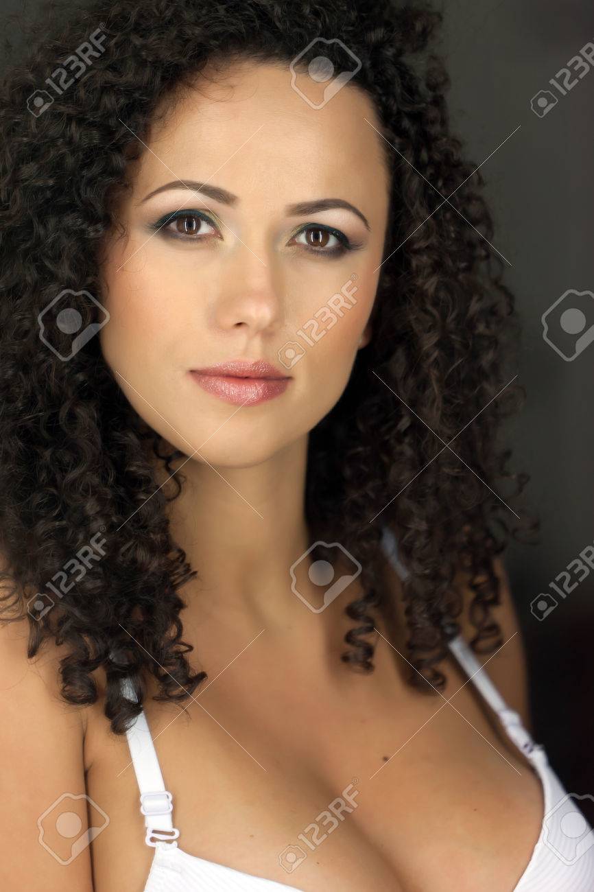 Pregnant Caucasian Woman With Beautiful Curly Hair With A Smily