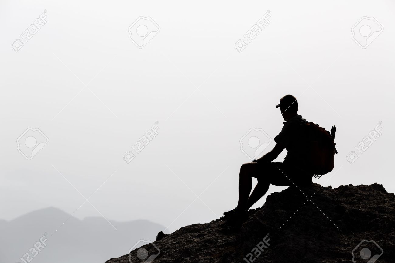 Man camping and hiking silhouette in mountains, inspiration and motivation concept. Hiker with backpack on top of rocky mountain looking at beautiful inspirational landscape. - 42152566 Man camping and hiking silhouette in mountains, inspiration and motivation concept. Hiker with backpack on top of rocky mountain looking at beautiful inspirational landscape. - 42152566