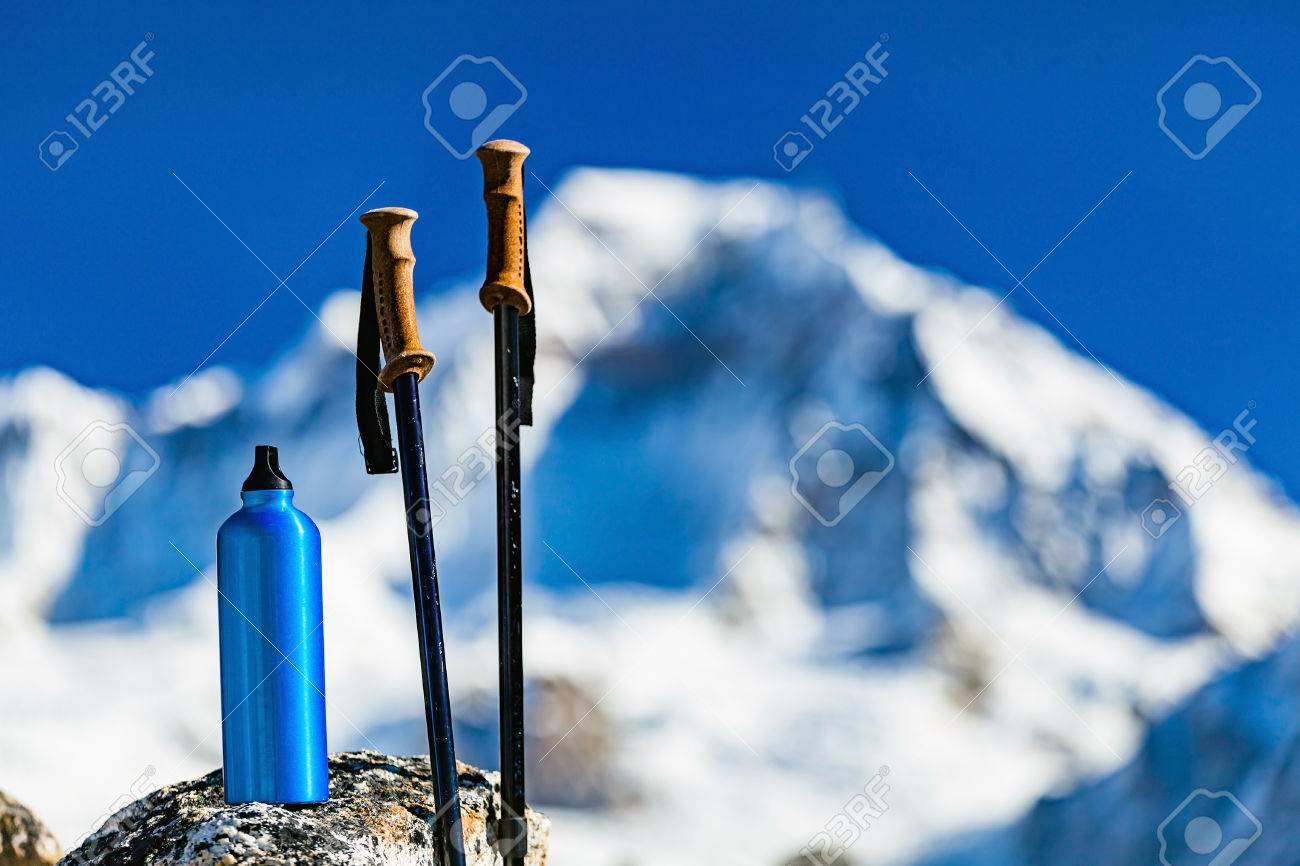 Hiking Gear Over Himalaya Mountains Background Travel Equipment Trekking Stick And Water Bottle In Inspirational High Himalayas Landscape Over Blue Sky In Nepal Stock Photo Picture And Royalty Free Image Image
