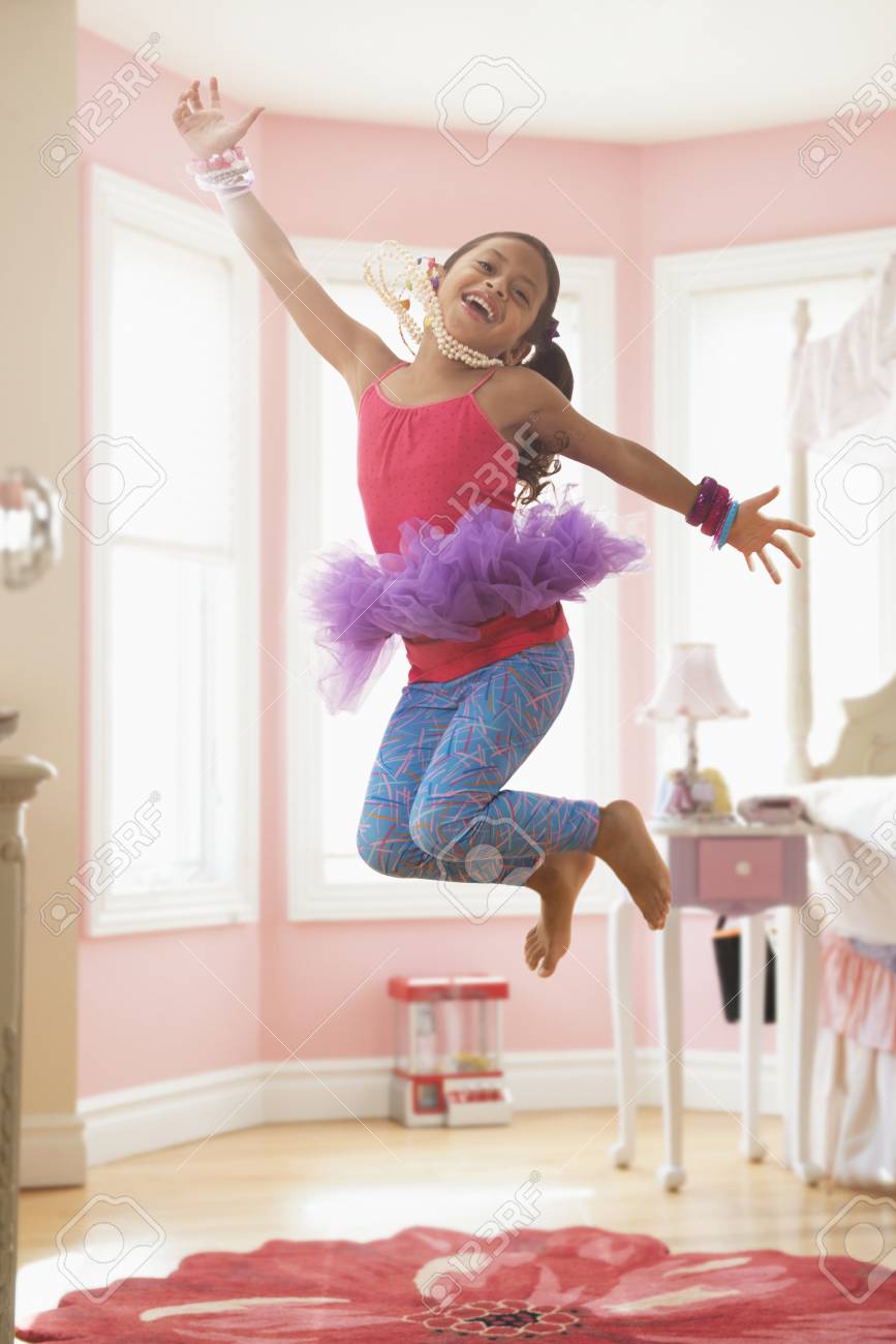 Girl Playing Dress Up In Bedroom