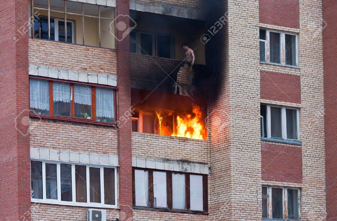 Fire in one of the apartments of a large tenement-house - 13096903 Fire in one of the apartments of a large tenement-house - 13096903