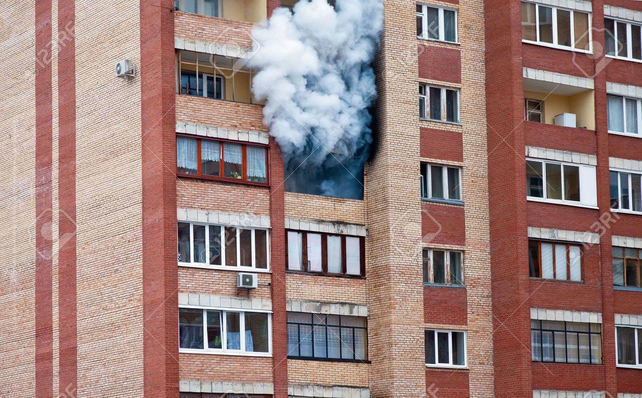 Fire in one of the apartments of a large tenement-house - 13096905 Fire in one of the apartments of a large tenement-house - 13096905