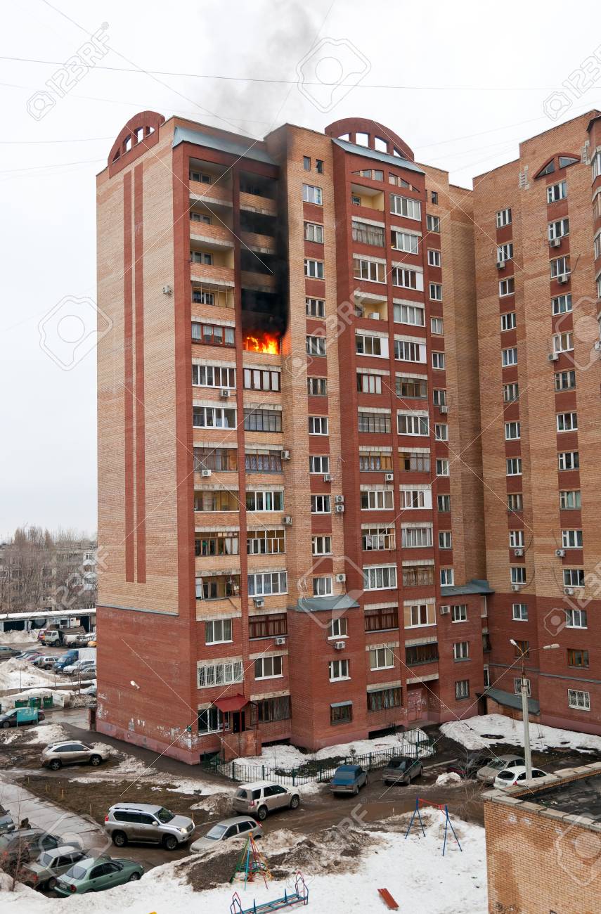 Fire in one of the apartments of a large tenement-house - 13289555 Fire in one of the apartments of a large tenement-house - 13289555