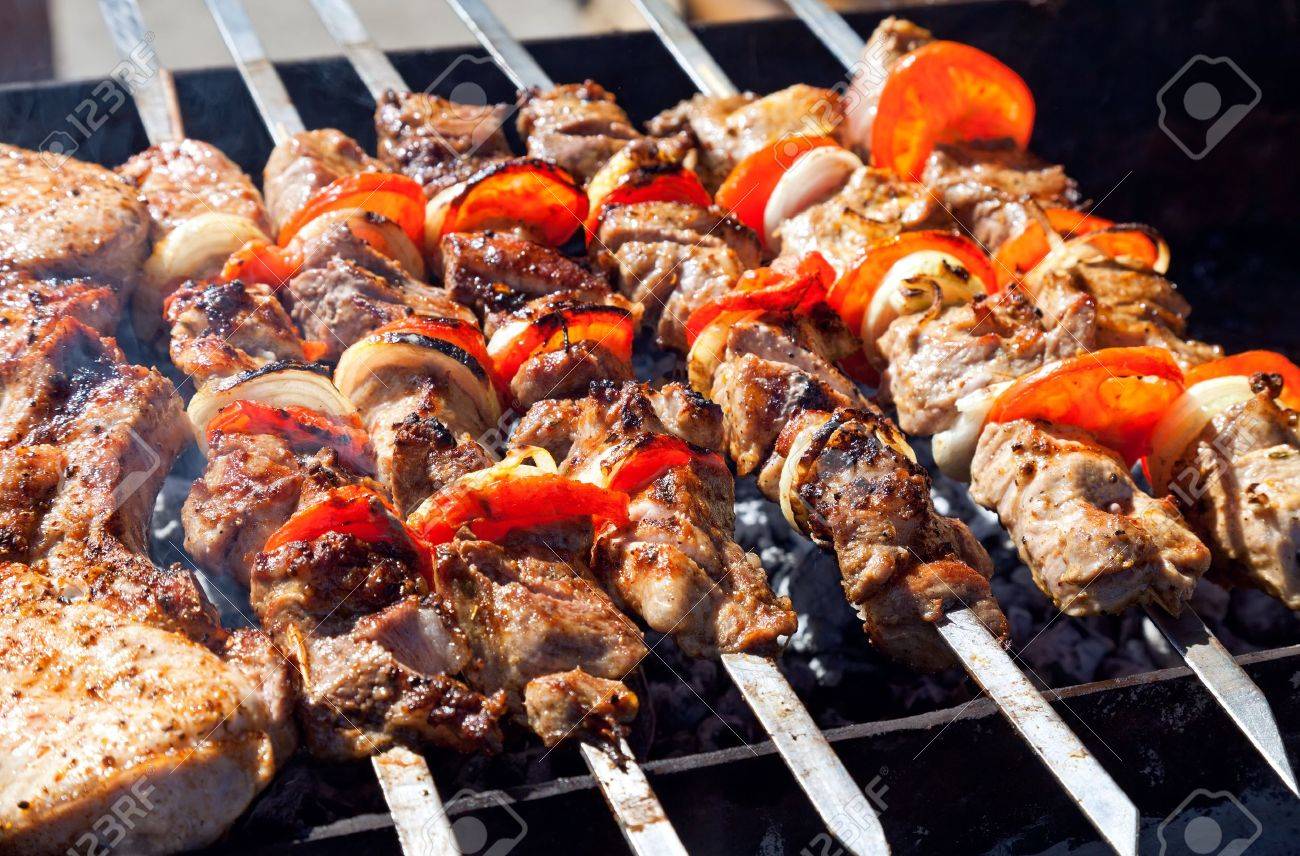 Appetizing fresh meat shish kebab shashlik prepared on a grill wood coal, outdor - 13293022 Appetizing fresh meat shish kebab shashlik prepared on a grill wood coal, outdor - 13293022