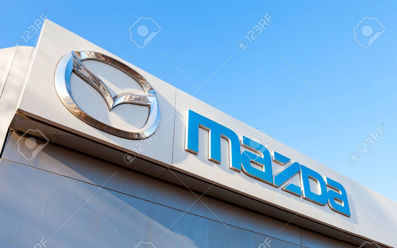 SAMARA, RUSSIA - FEBRUARY 20, 2016: Official dealership sign of Mazda. Mazda Motor Corporation is a Japanese automaker - 52927312 SAMARA, RUSSIA - FEBRUARY 20, 2016: Official dealership sign of Mazda. Mazda Motor Corporation is a Japanese automaker - 52927312