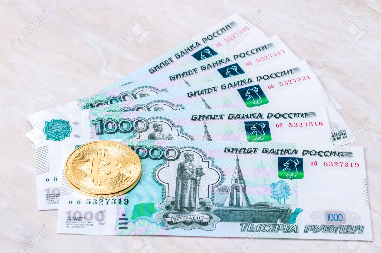 Cryptocurrency Coins Lying On The Russian Ruble Banknotes. Business Concept  Of New Virtual Money Stock Photo, Picture and Royalty Free Image. Image  91587320.