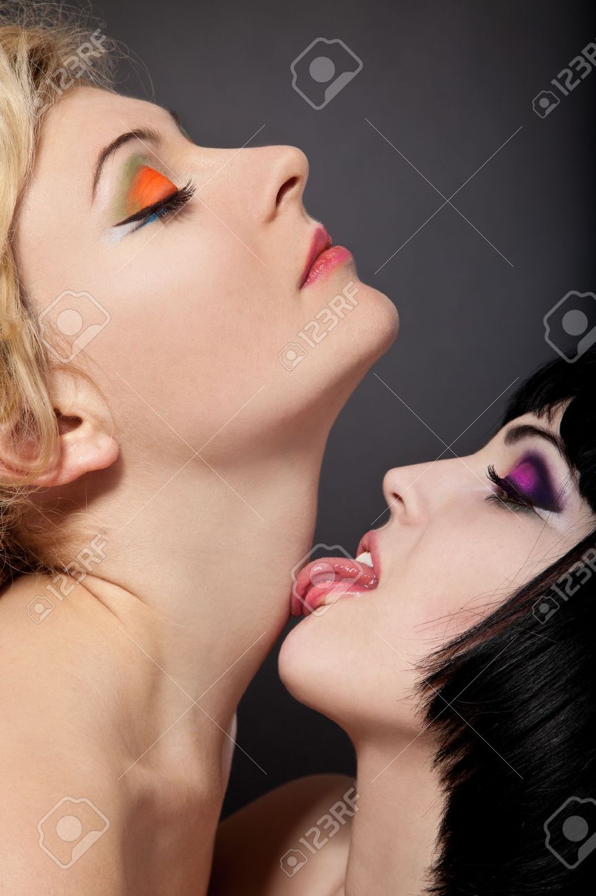 Two Young Attractive Lesbians Kissing Isolated On Gray Background Stock Photo, Picture and Royalty Free Image picture