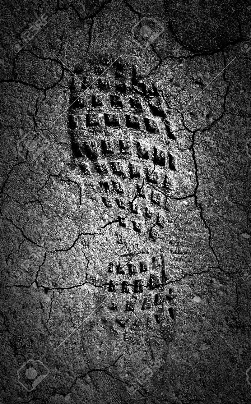 Forgotten footprint in the moonlight A abstract image of a black and white image of a boot print in dried out mud - 29206020 Forgotten footprint in the moonlight A abstract image of a black and white image of a boot print in dried out mud - 29206020