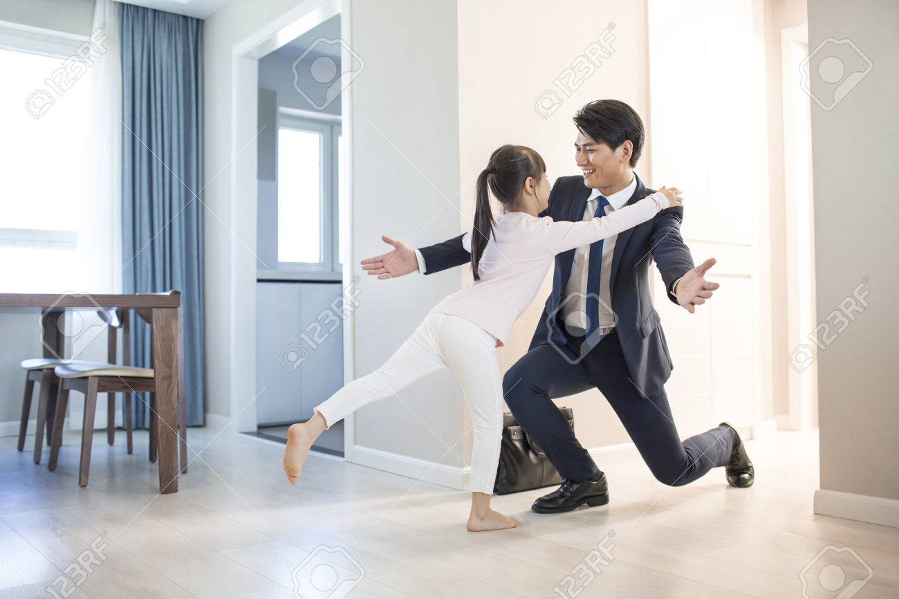 young father come back home from work stock photo picture and