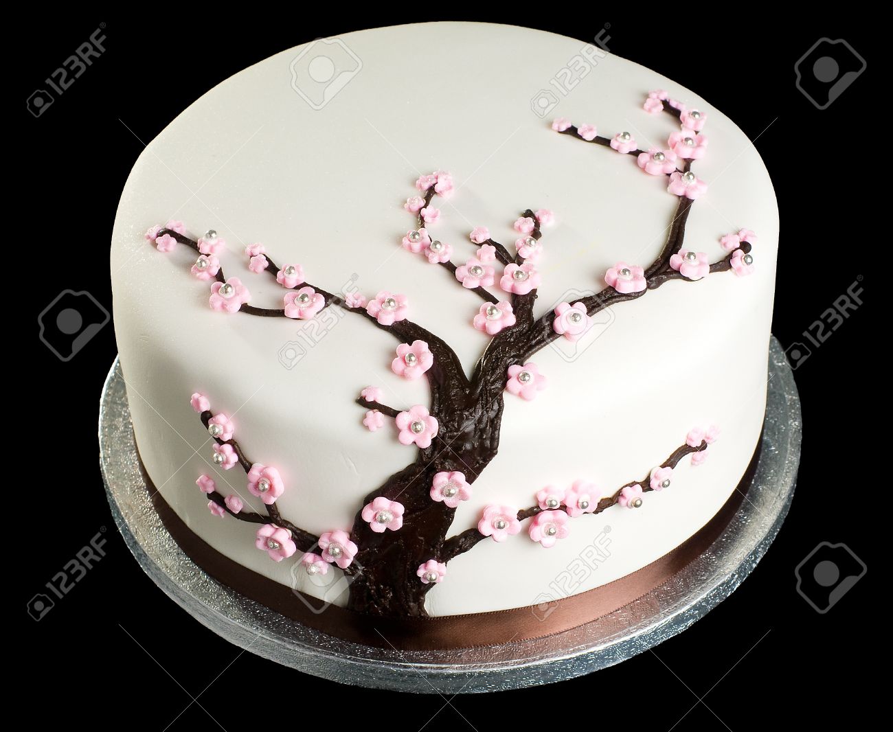 Close Up Of Cake With Cherry Blossom On Isolated Black Background Stock Photo Picture And Royalty Free Image Image