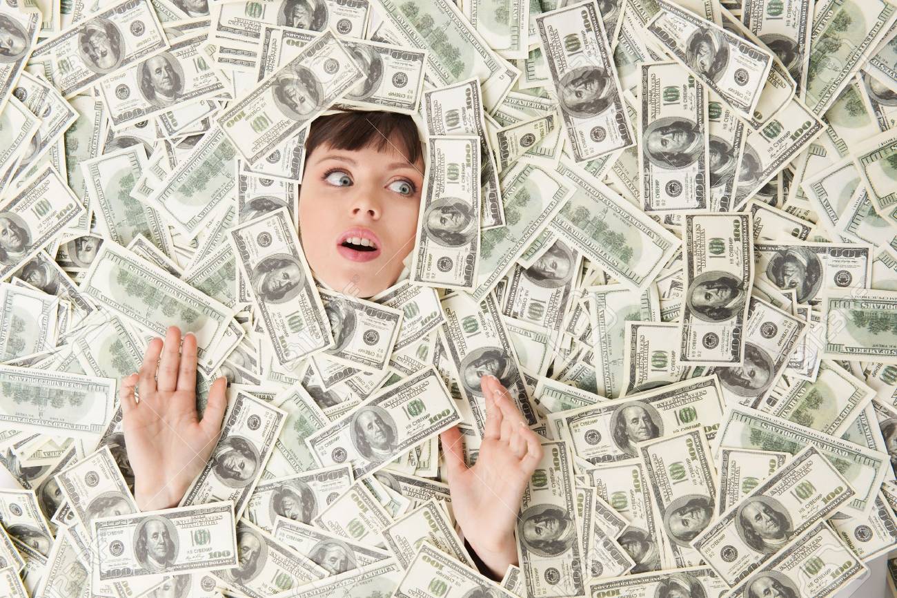 Rich Woman. Top View Of Surprised Young Woman Covered With US.. Stock Photo, tookhuay.com. Image 21986123.