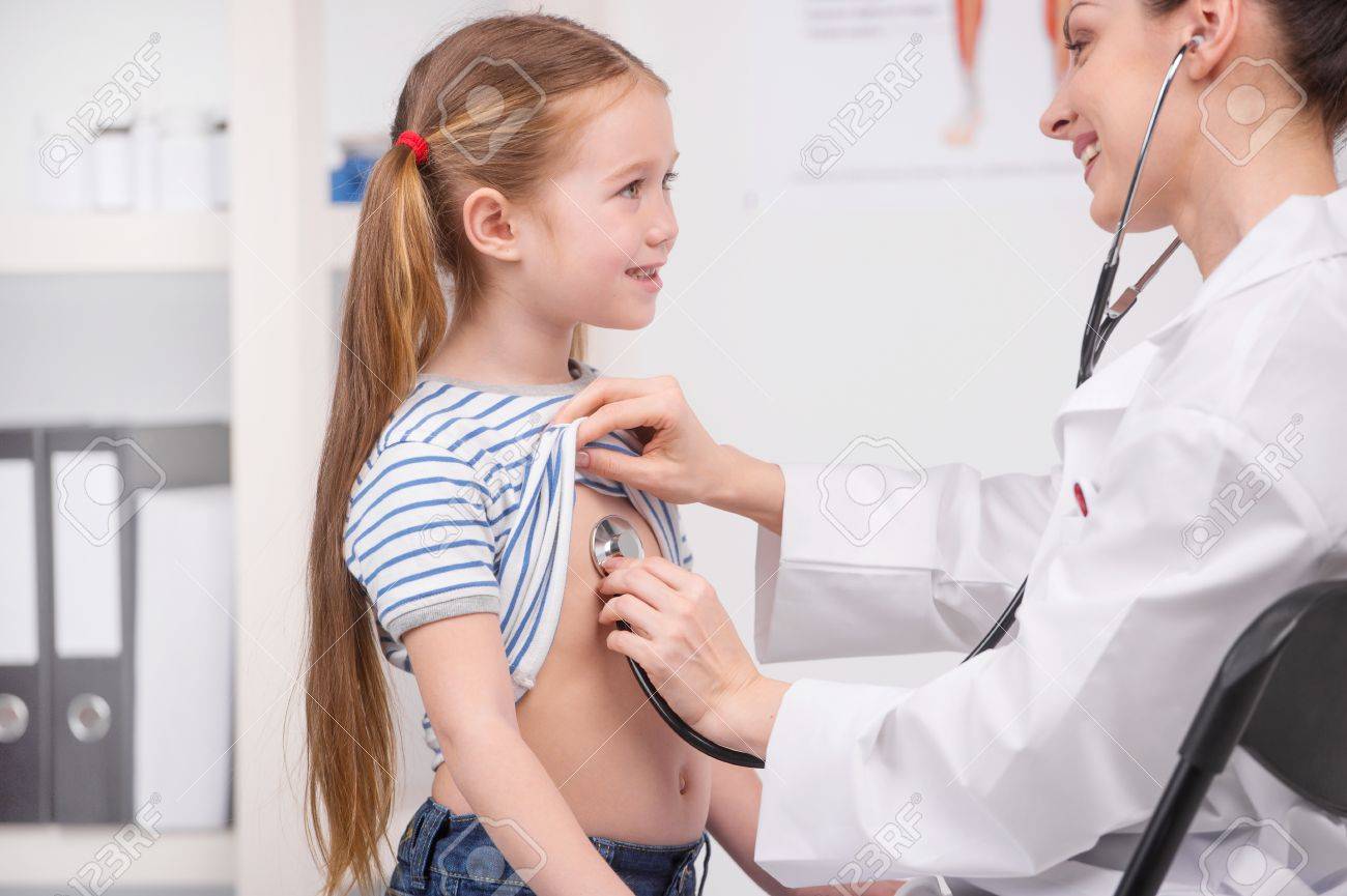 Medical Exam Cheerful Young Doctor In Lab Coat Examining Little Stock Photo Picture And Royalty Free Image Image Medical Exam Cheerful Young Doctor In Lab Coat Examining Little Stock Photo Picture And Royalty Free Image Image