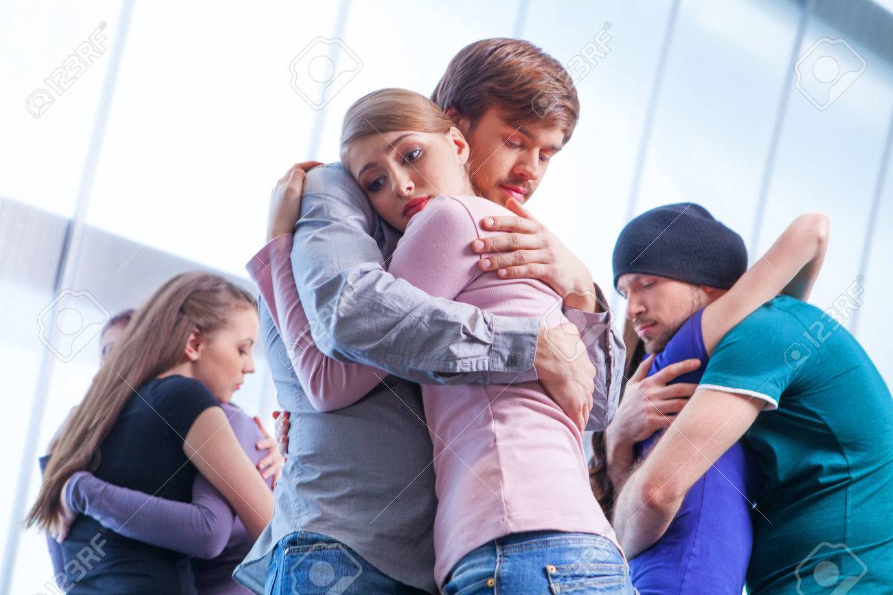 three pair of people hugging each other girl with upset look