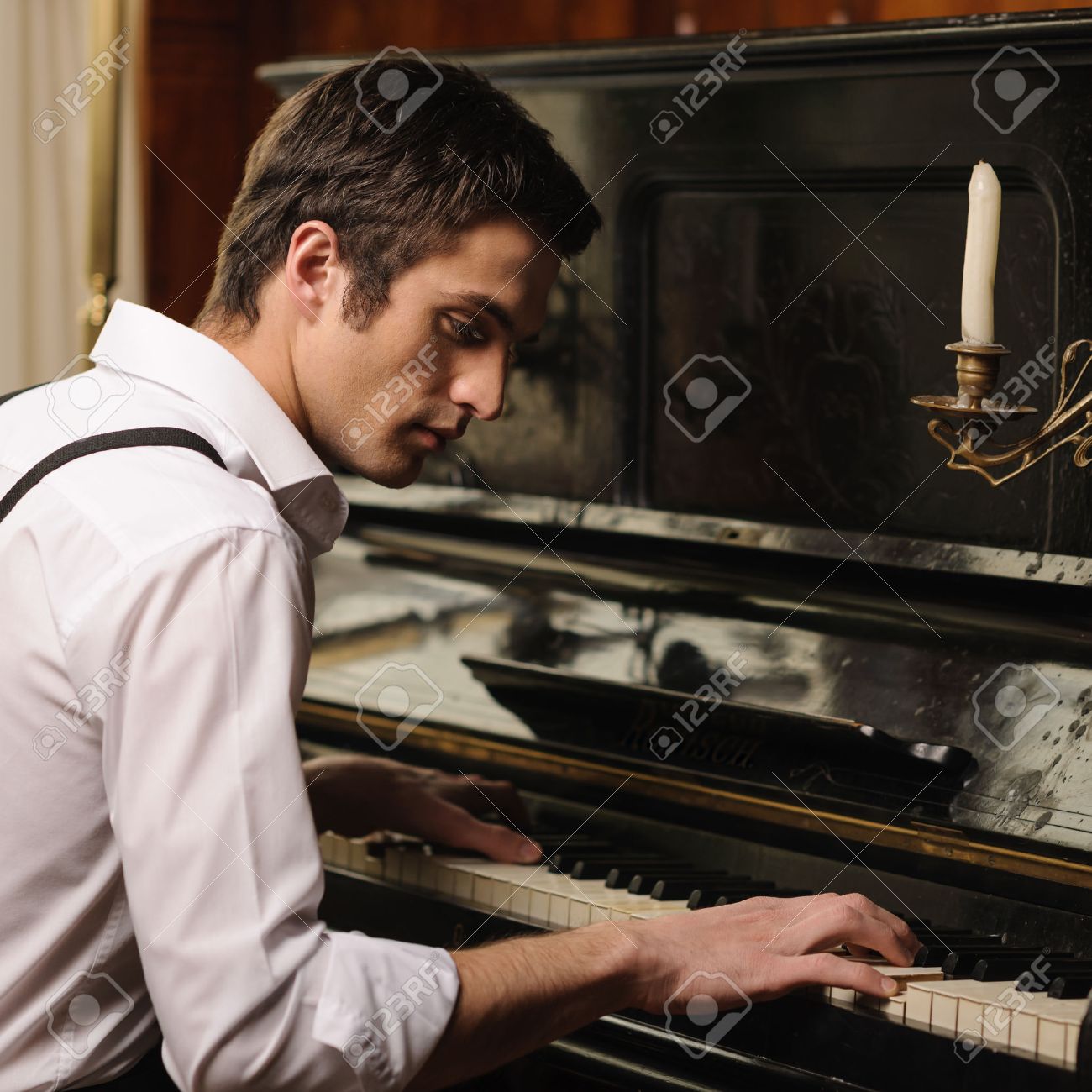 Image result for images of a man playing a piano