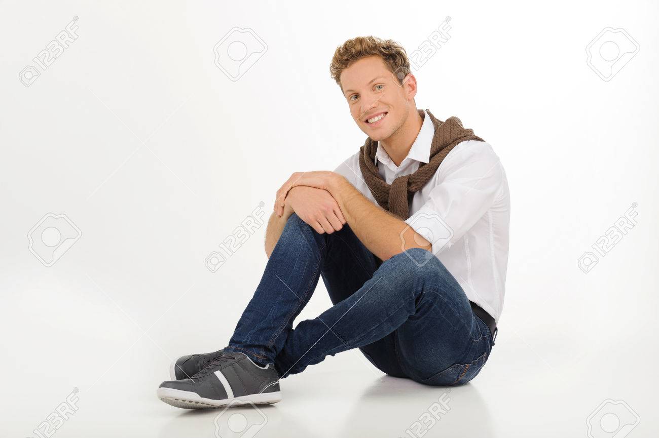 Handsome Young Men Cheerful Young Men Young Men Sitting On The Floor And Smiling While Isolated On White Stock Photo Picture And Royalty Free Image Image