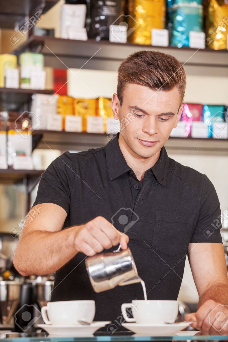 Young Male Barista Adding Milk Handsome Man Making Coffee And Young Male Barista Adding Milk Handsome Man Making Coffee And