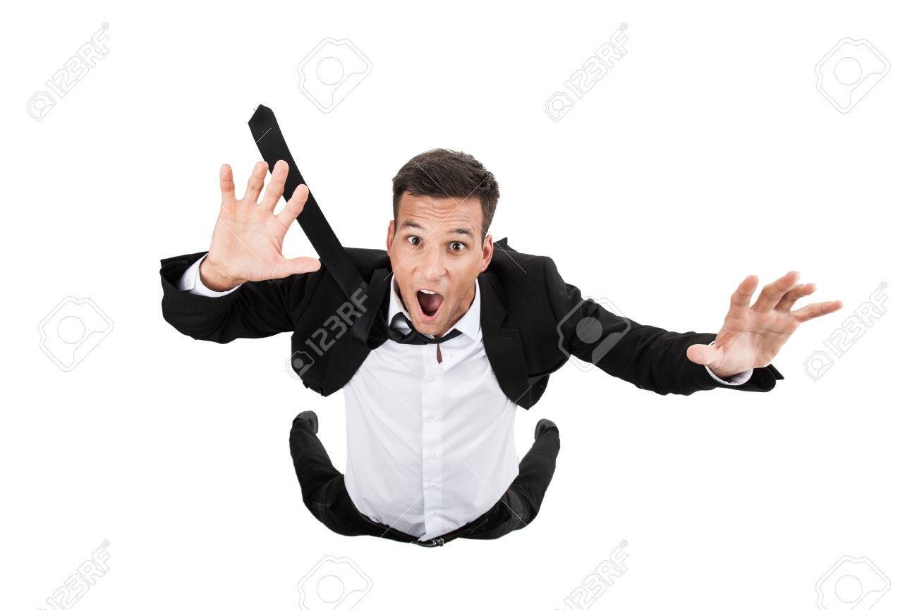 Scared young businessman in falling position. flying businessman on white background and crying - 30902870 Scared young businessman in falling position. flying businessman on white background and crying - 30902870