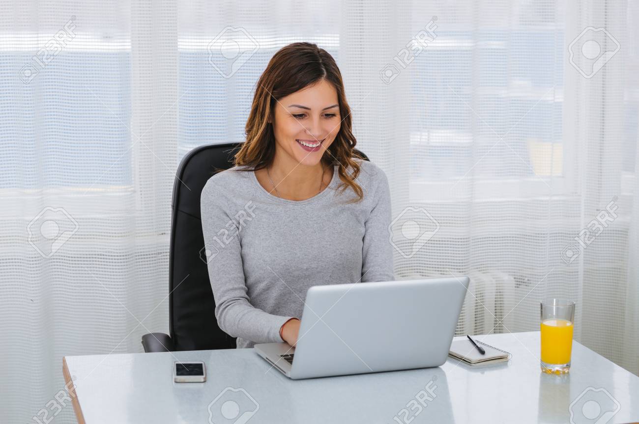 Beautiful Young Freelancer Woman Using Laptop Computer At Home... Stock Photo, Picture And Royalty Free Image. Image 96567065.