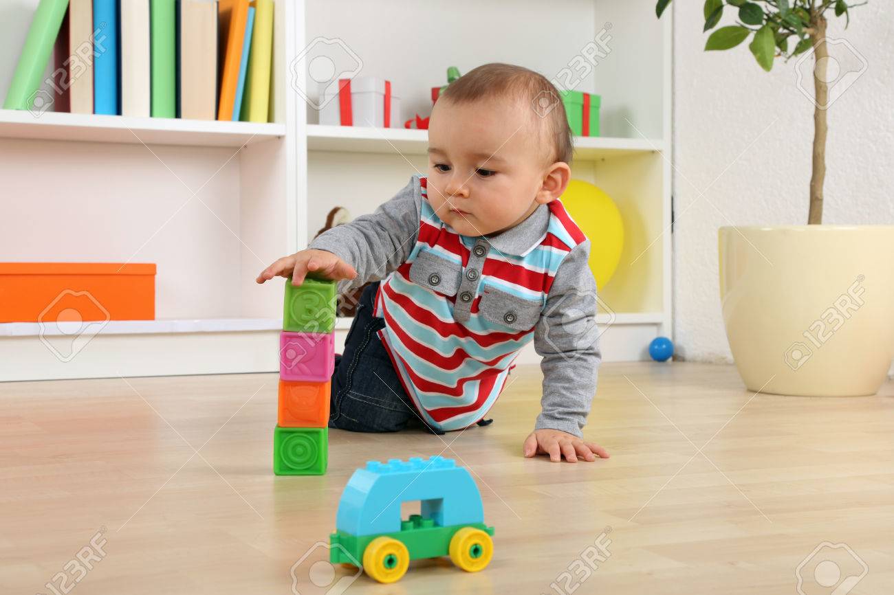 Baby Playing With Cubes And Bricks Car Toy In Children S Room Stock Photo Picture And Royalty Free Image Image